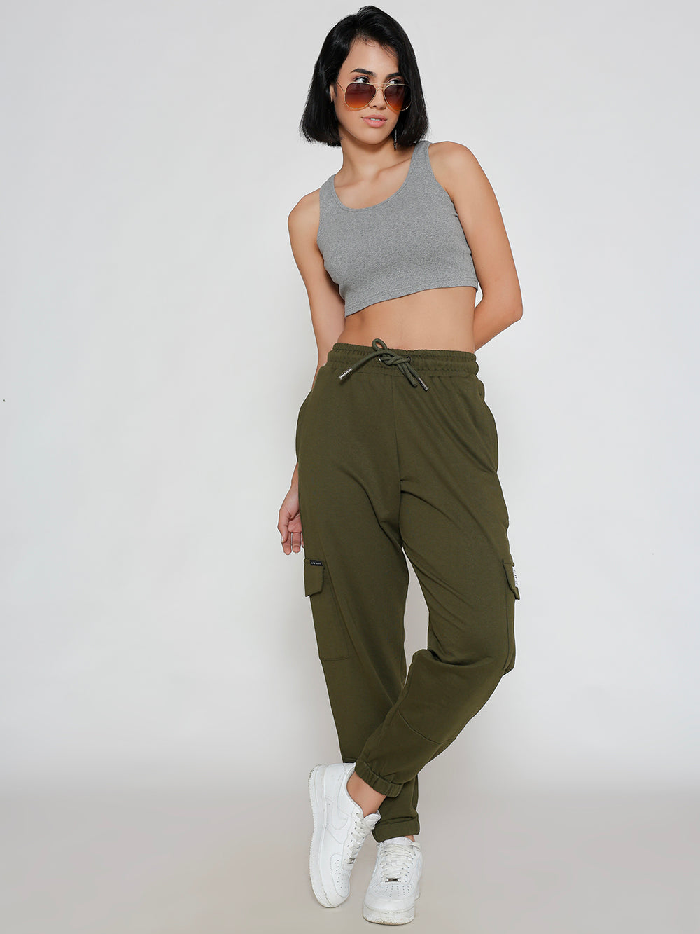 Side view of olive cotton cargo pants showing cargo pocket
