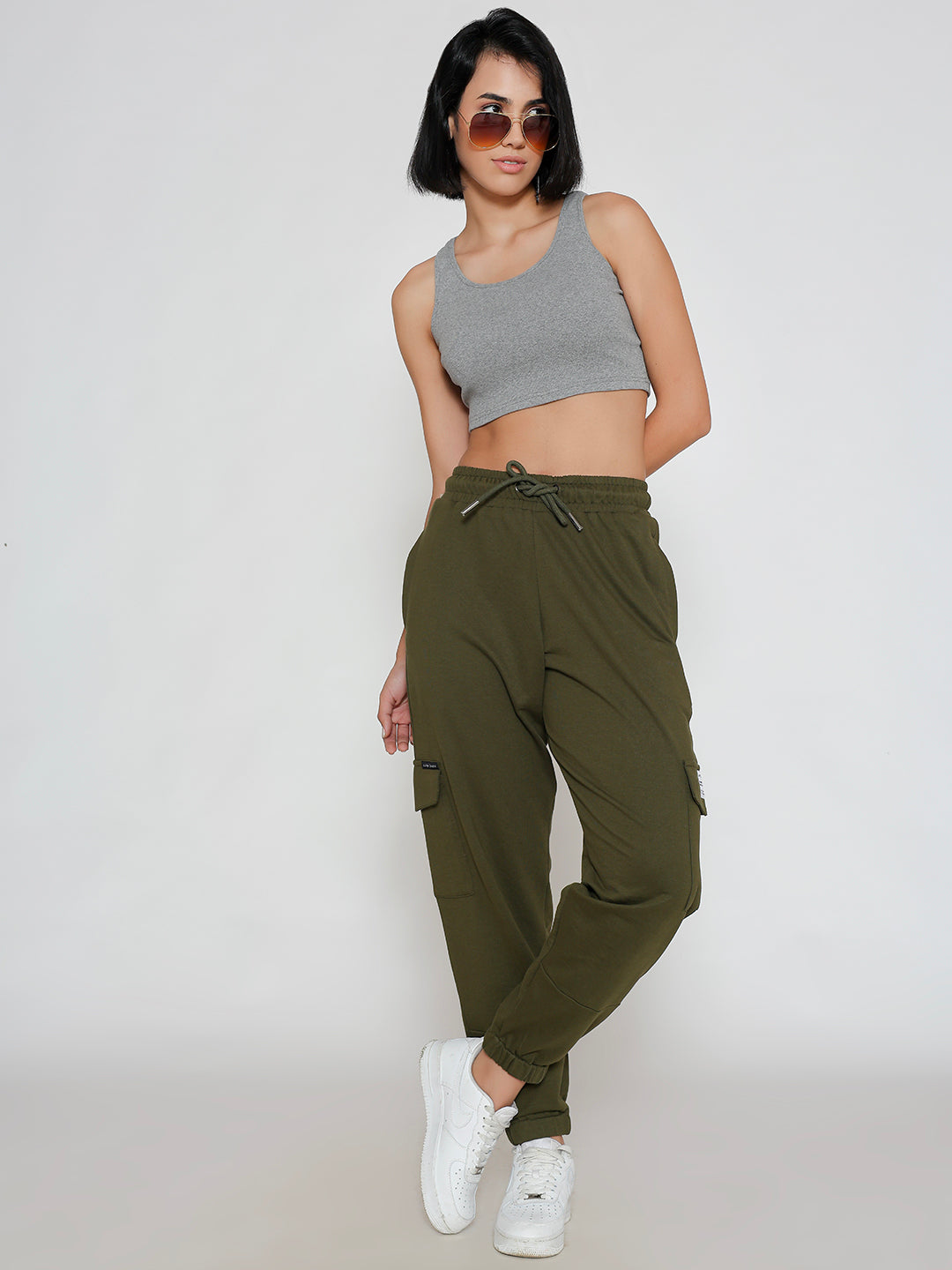 Side view of olive cotton cargo pants showing cargo pocket