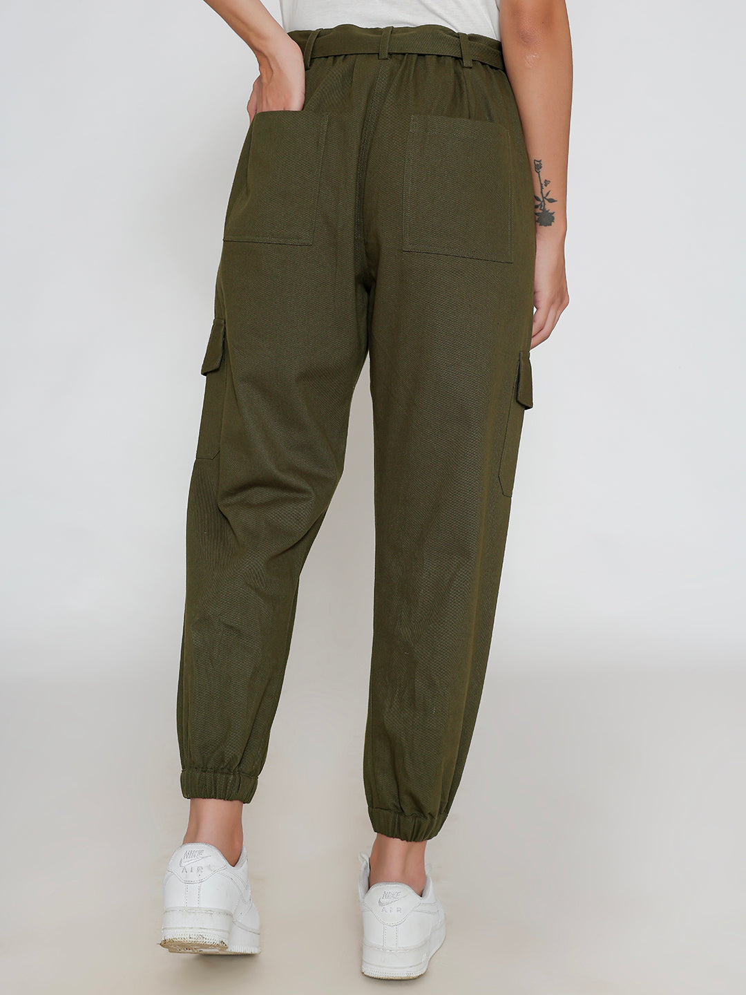 Close-up of elastic waistband on olive cargo pants