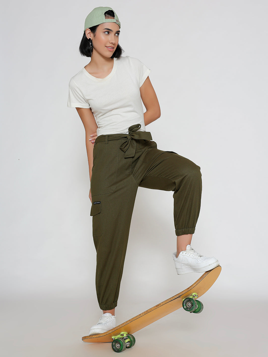 Side view of olive cotton cargo pants showing cargo pocket