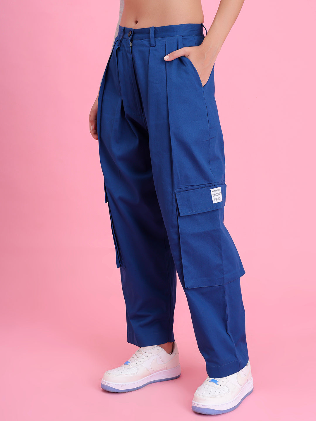 Close-up of elastic waistband on navy cargo pants