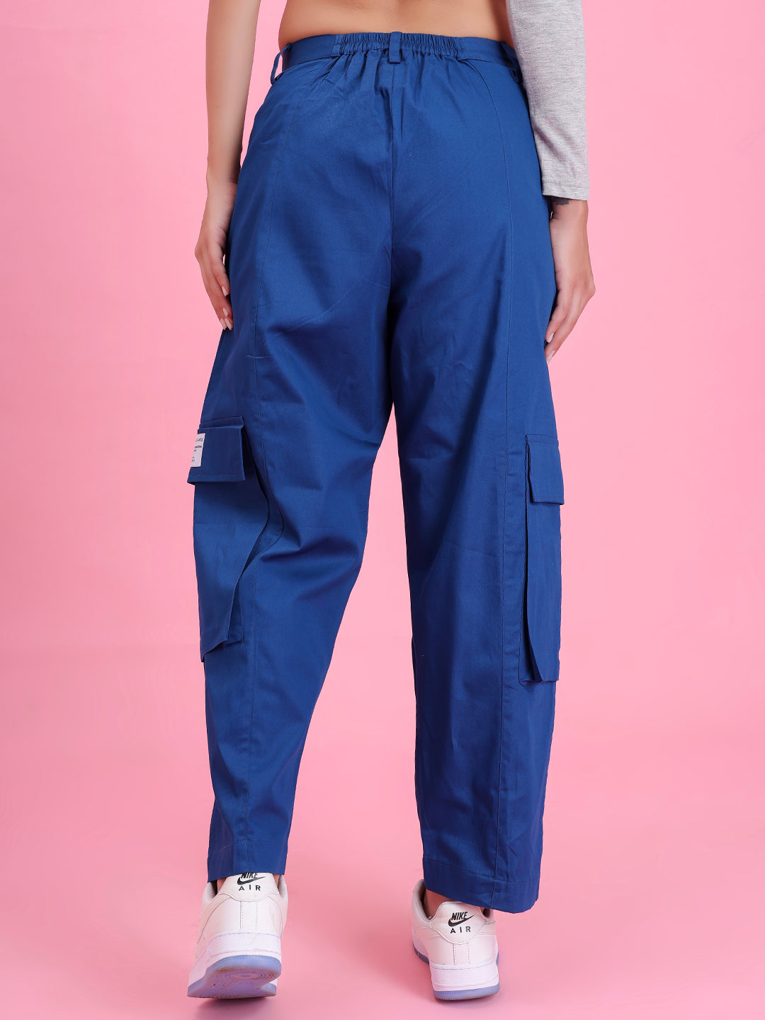 Lifestyle shot of navy utility cargo pants with a tee