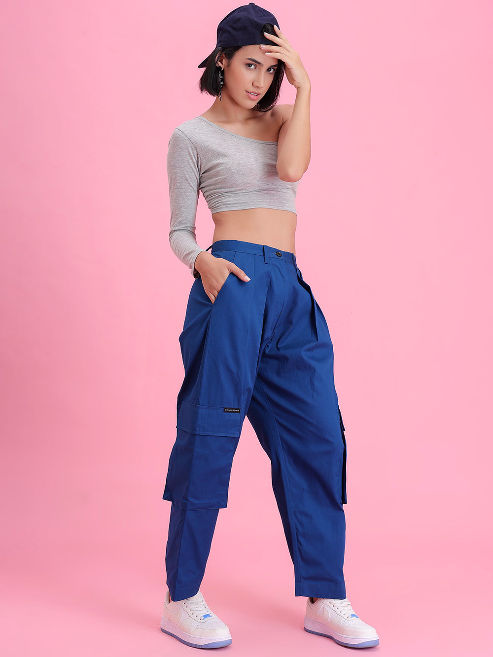 Side view of navy cotton cargo pants showing cargo pocket
