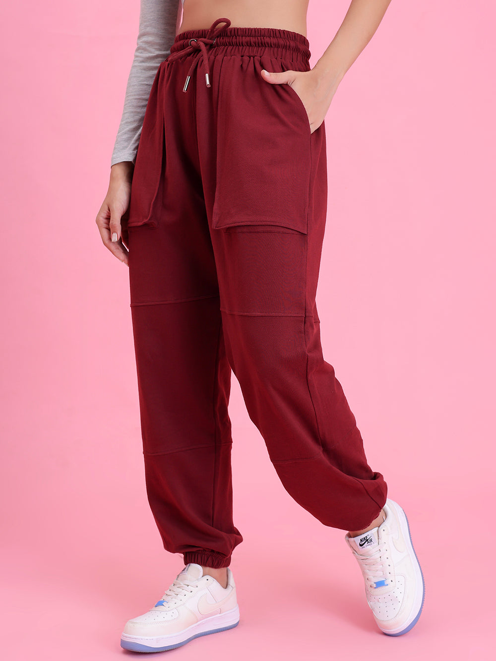 Side view of wine cotton joggers showing pocket and elastic waist