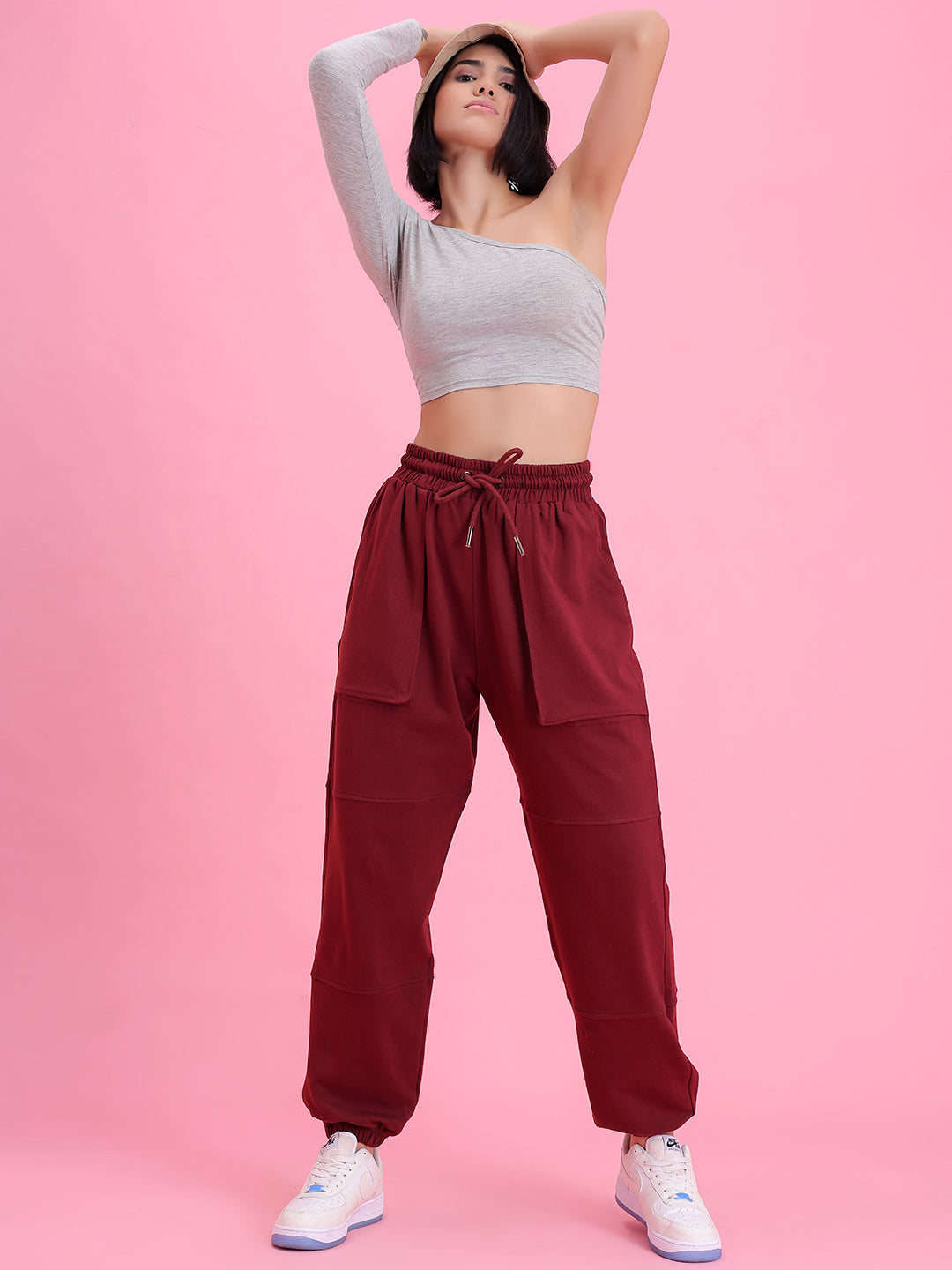 Close-up of elastic waistband on wine knit joggers