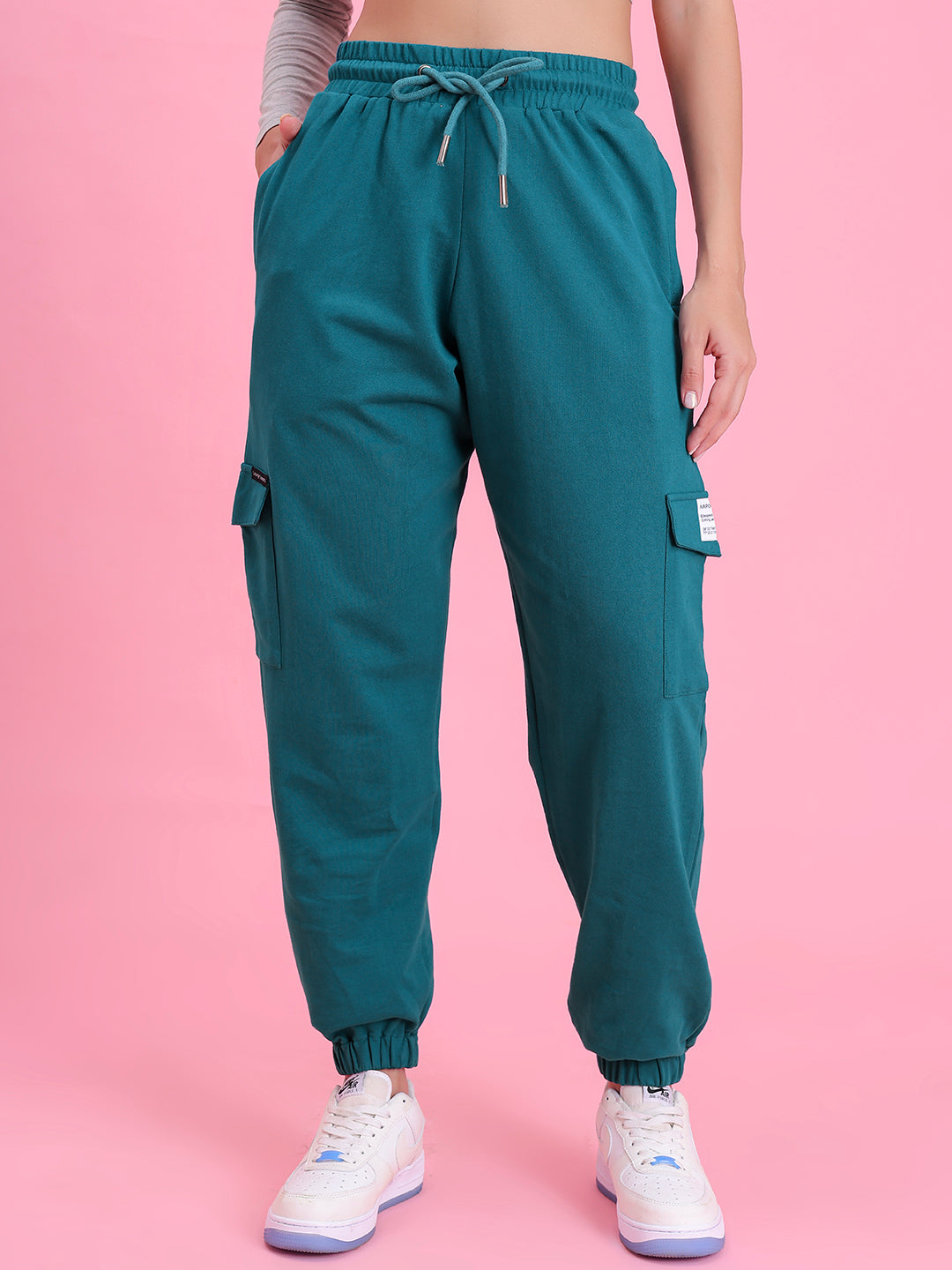 Front view of teal cotton cargo pants with multi-pockets