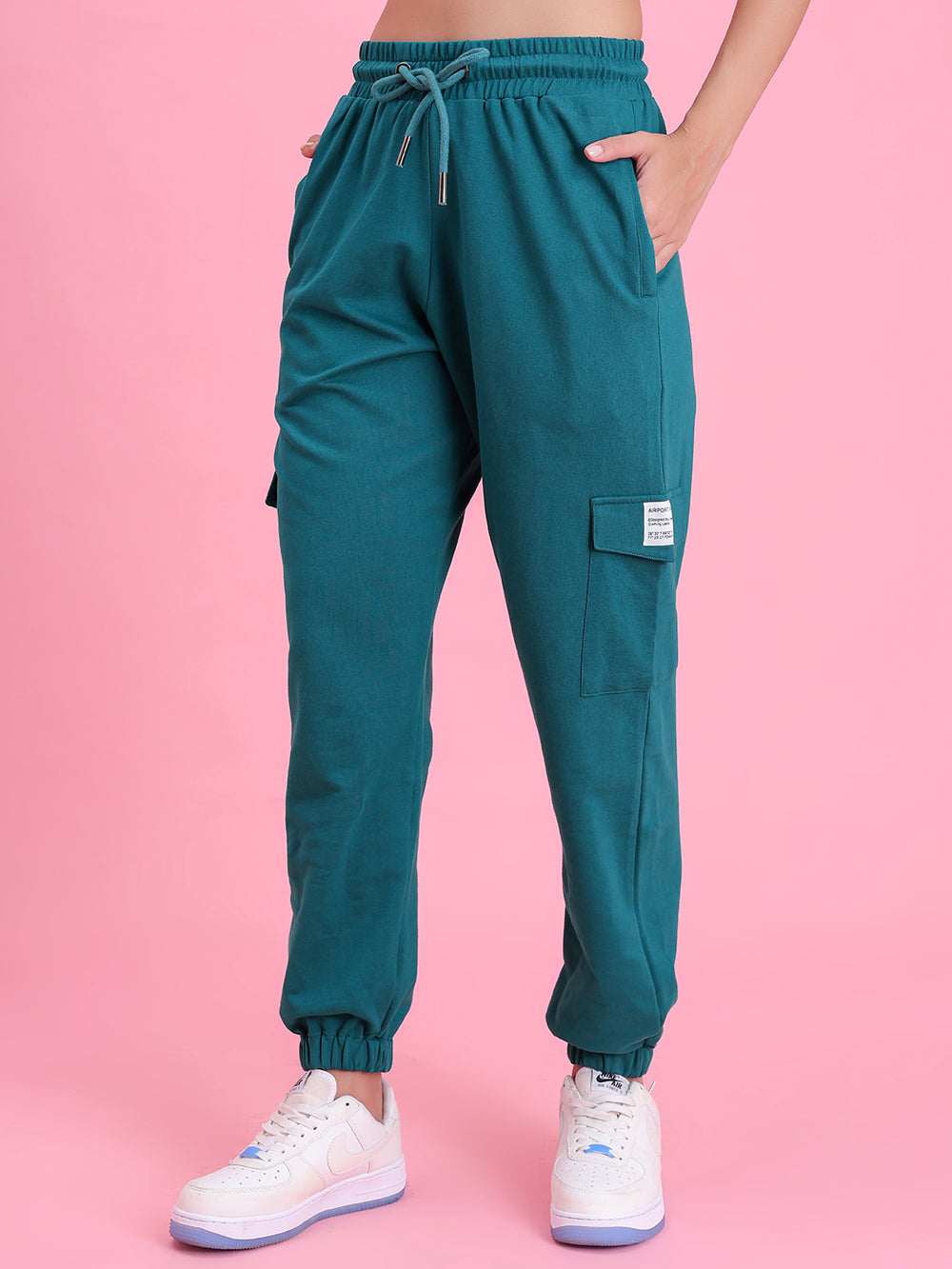 Side view of teal cotton cargo pants showing cargo pocket