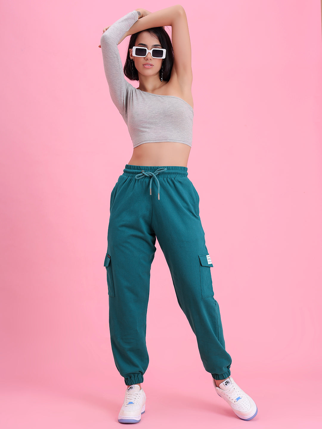 Close-up of elastic waistband on teal cargo pants