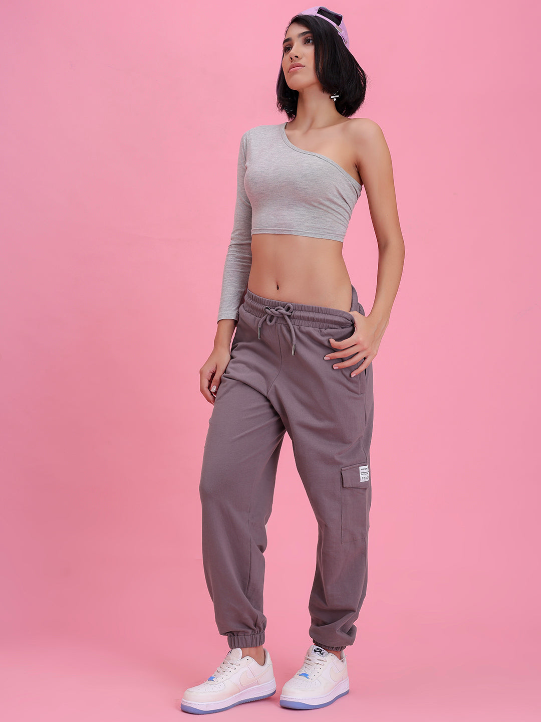 Model wearing lavender cotton cargo pants in a casual look