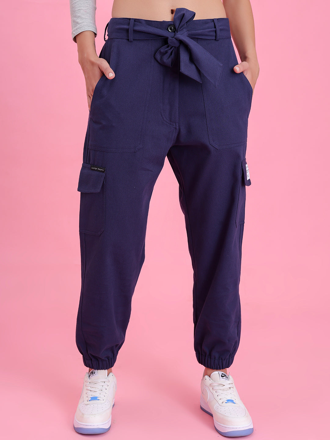 Detail of cargo pocket on navy cotton pants
