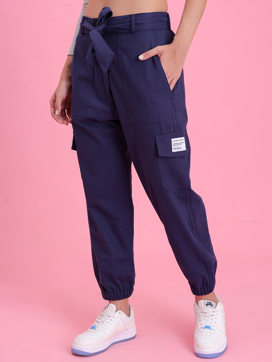 Close-up of elastic waistband on navy cargo pants