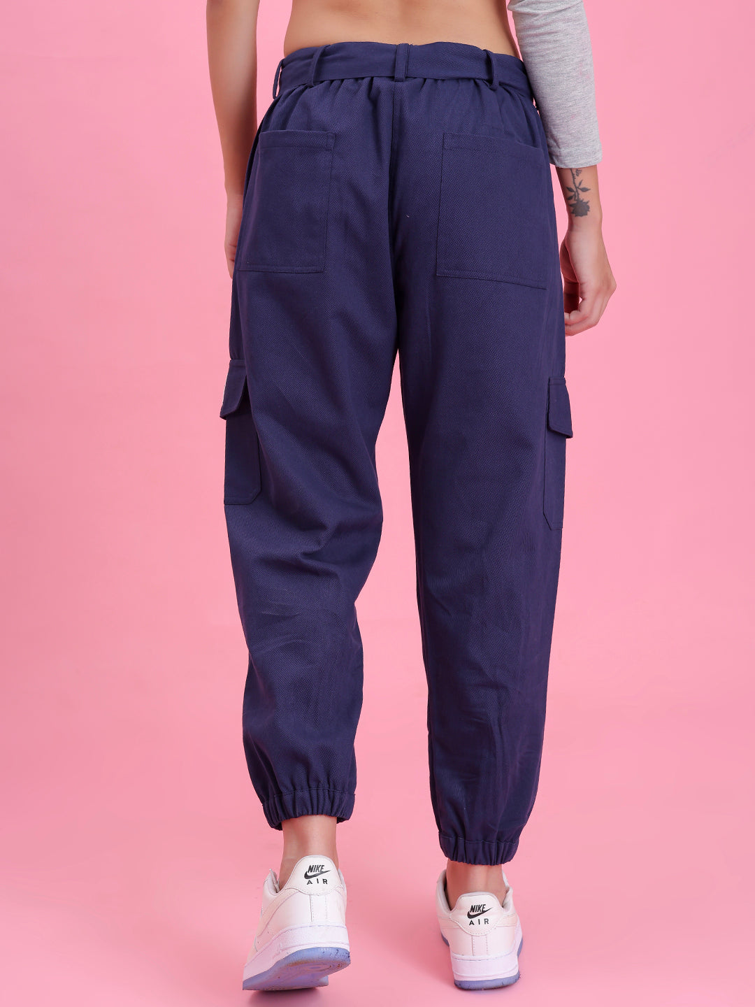 Lifestyle shot of navy cargo pants with a tee