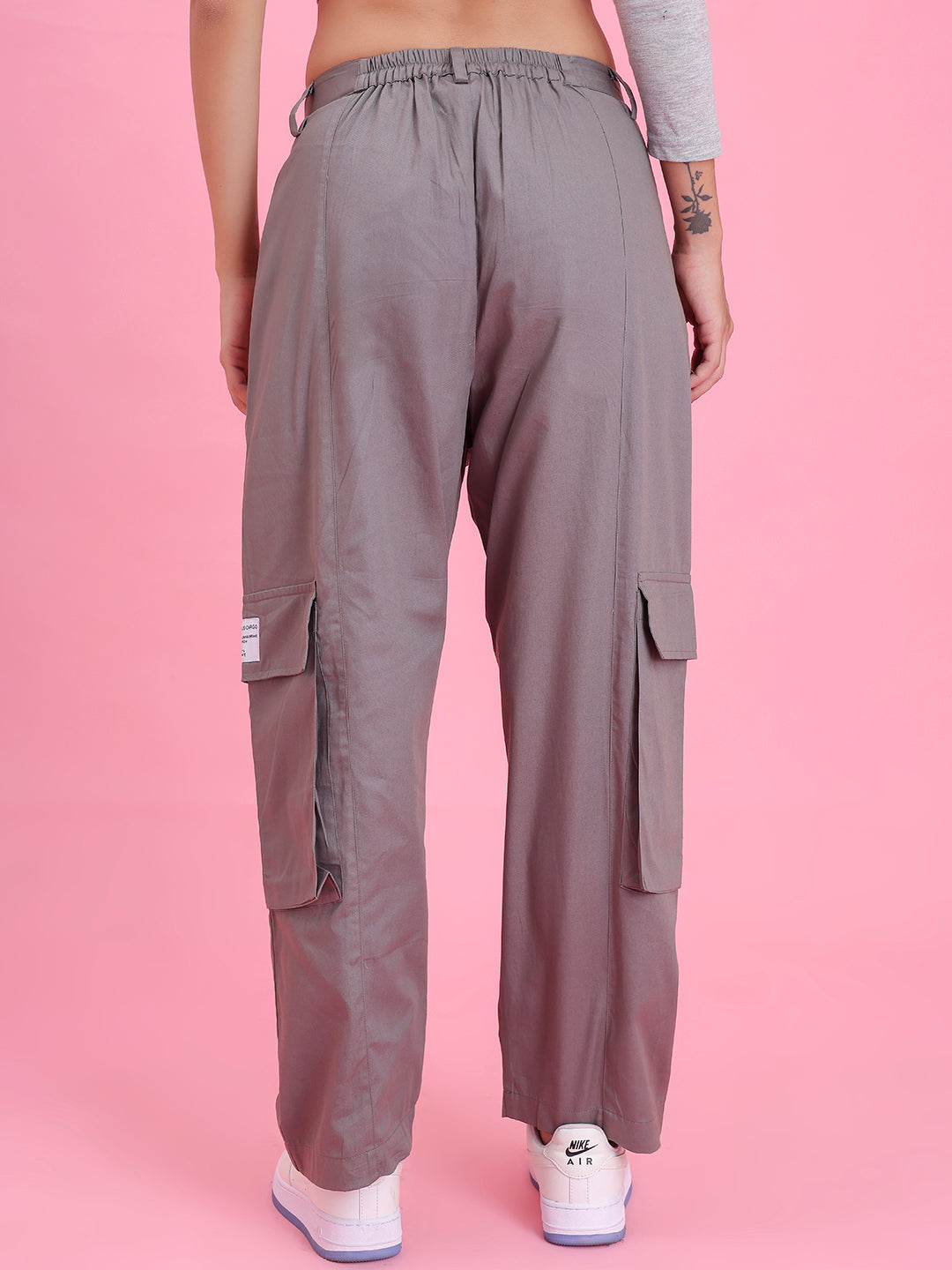 Lifestyle shot of grey cargo pants with a tee