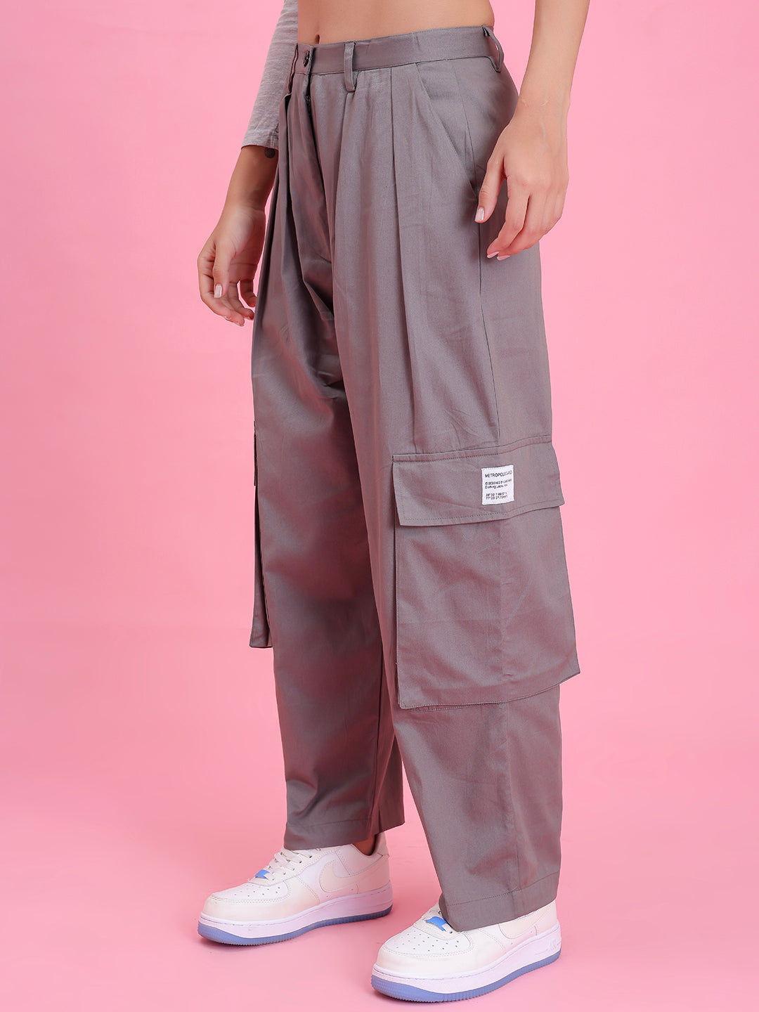 Model wearing grey cotton cargo pants in a casual look
