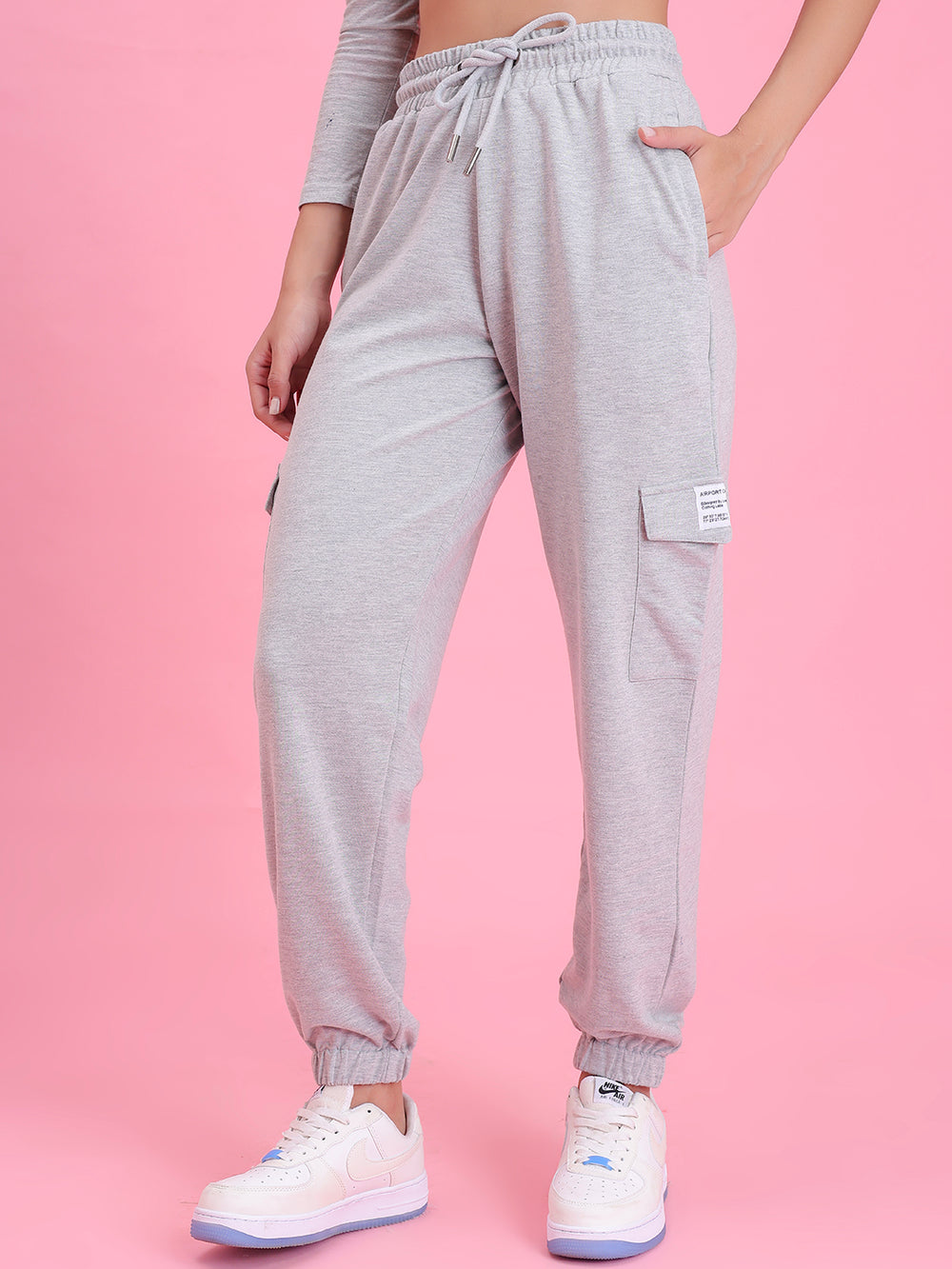 Side view of grey cotton cargo pants showing cargo pocket