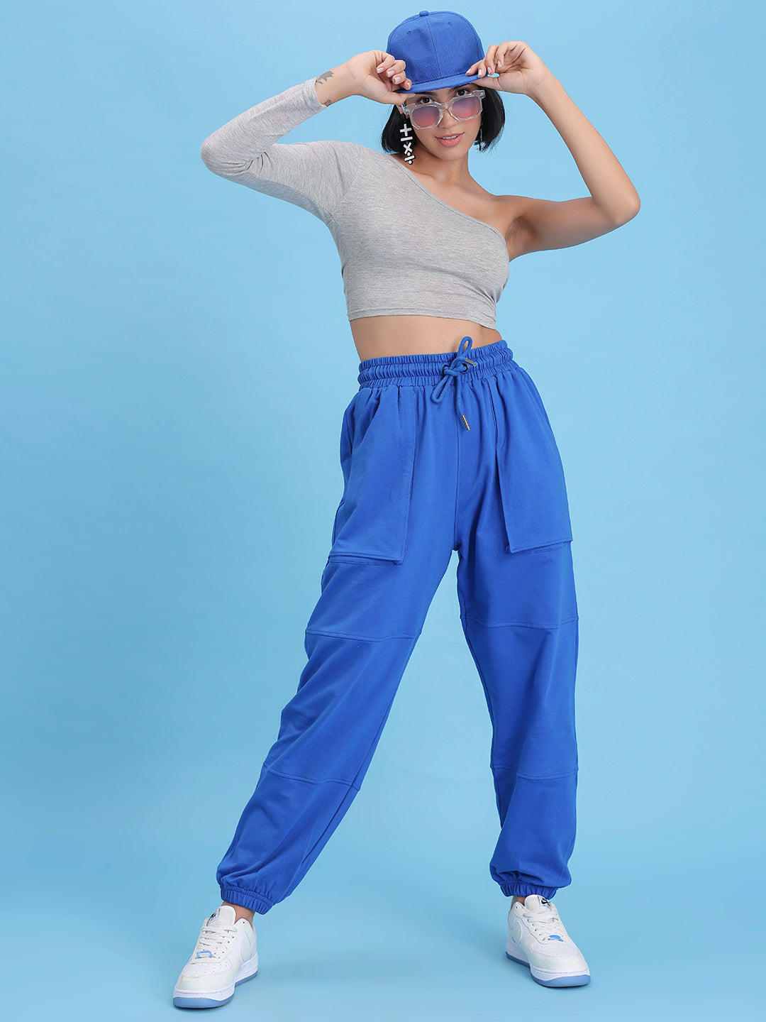 Detail of cuffed hem on blue cotton joggers