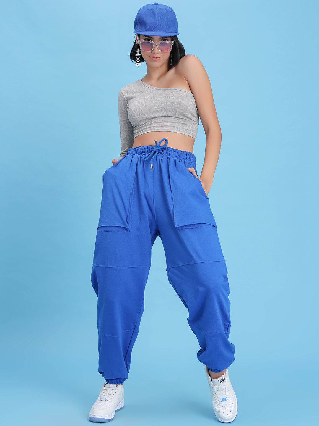 Close-up of elastic waistband on blue knit joggers