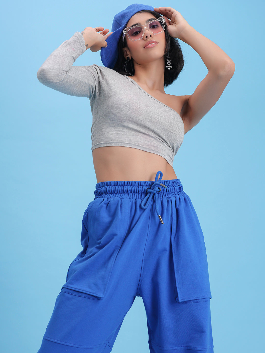 Model wearing blue cotton joggers in a casual look