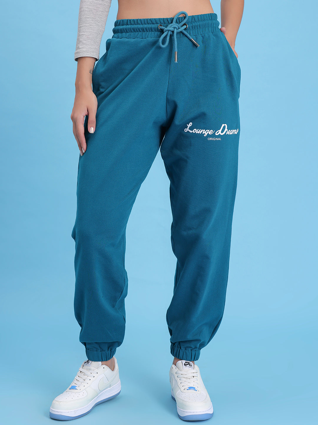 Front view of teal cotton knit joggers with tapered leg