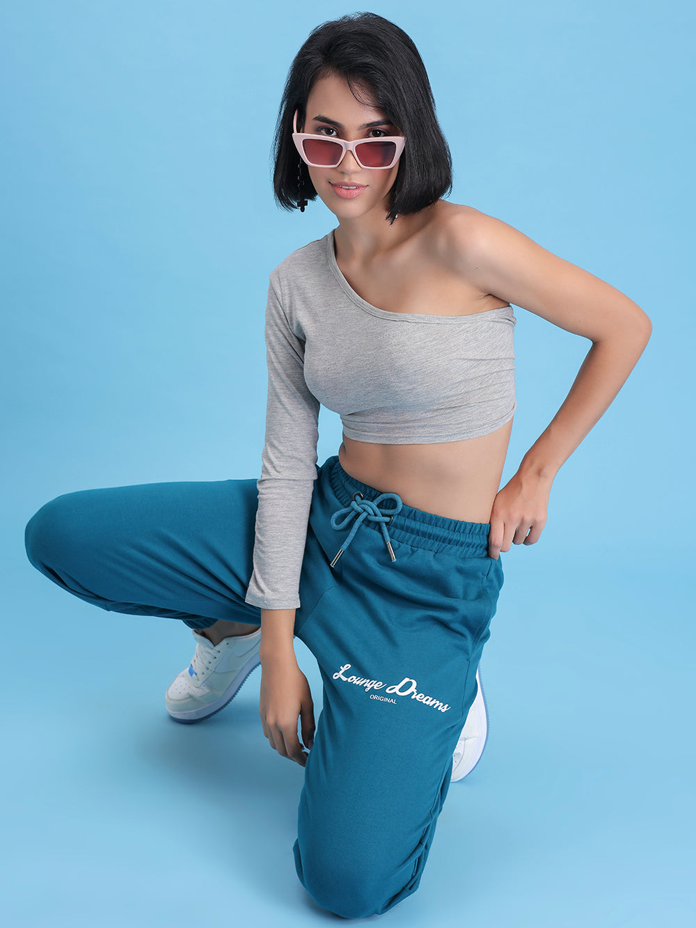 Side view of teal cotton joggers showing pocket
