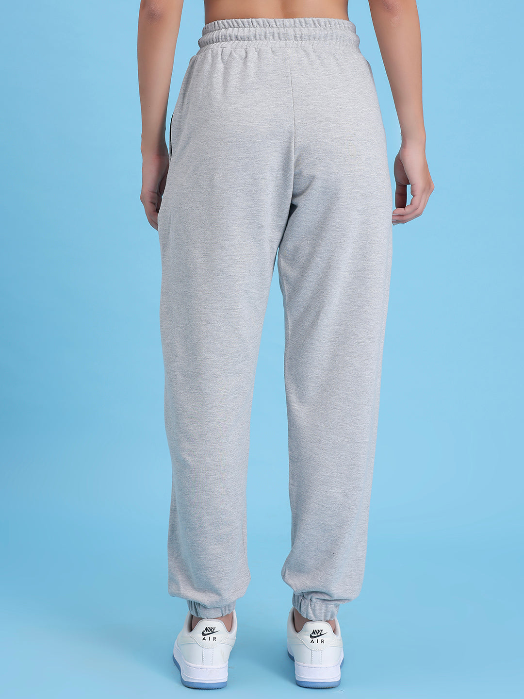 Detail of cuffed hem on grey cotton joggers