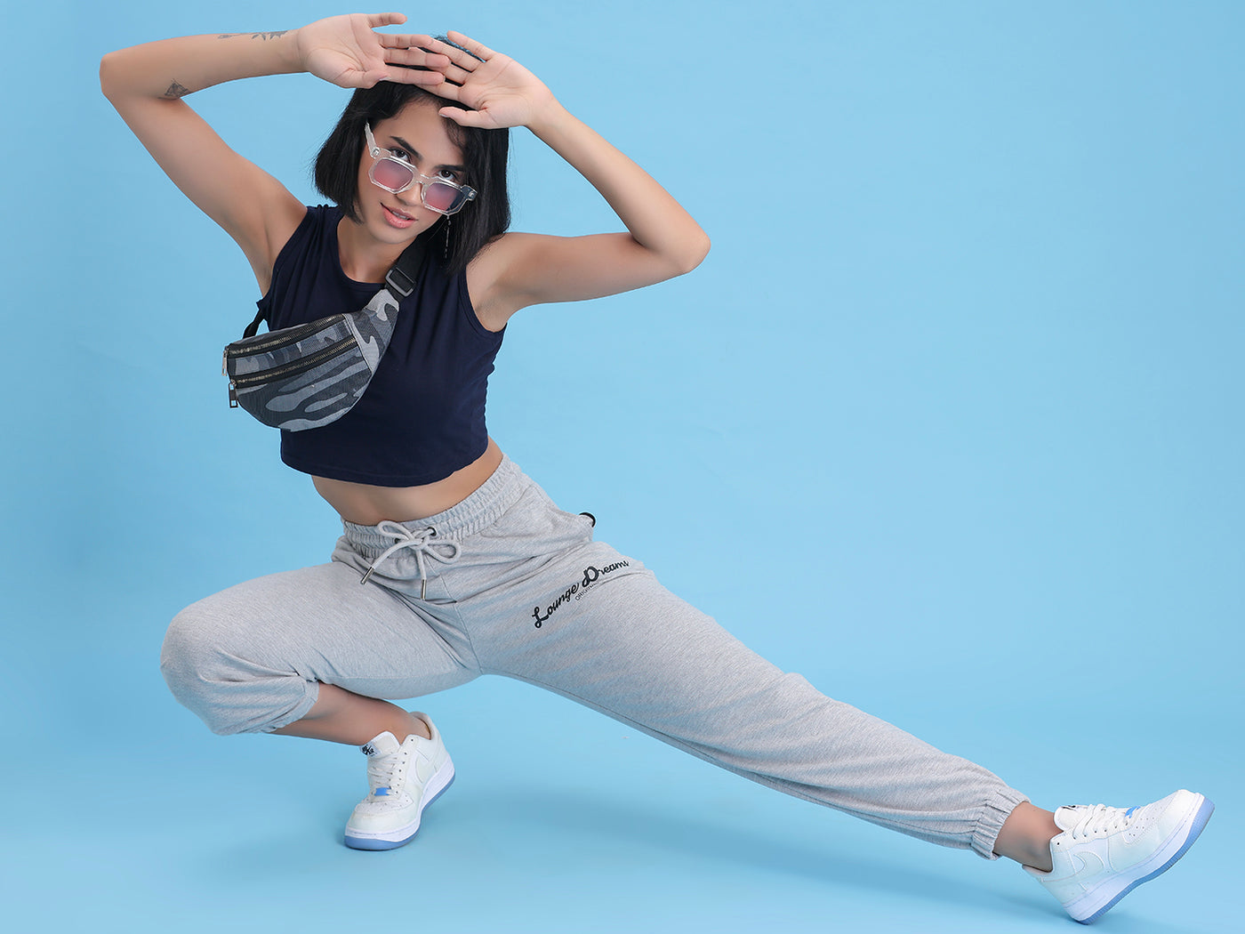 Model wearing grey cotton joggers in a casual look