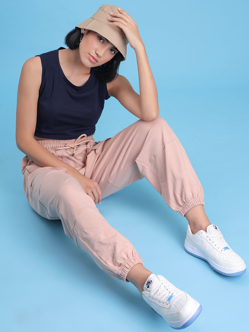 Side view of beige cotton joggers showing side pocket