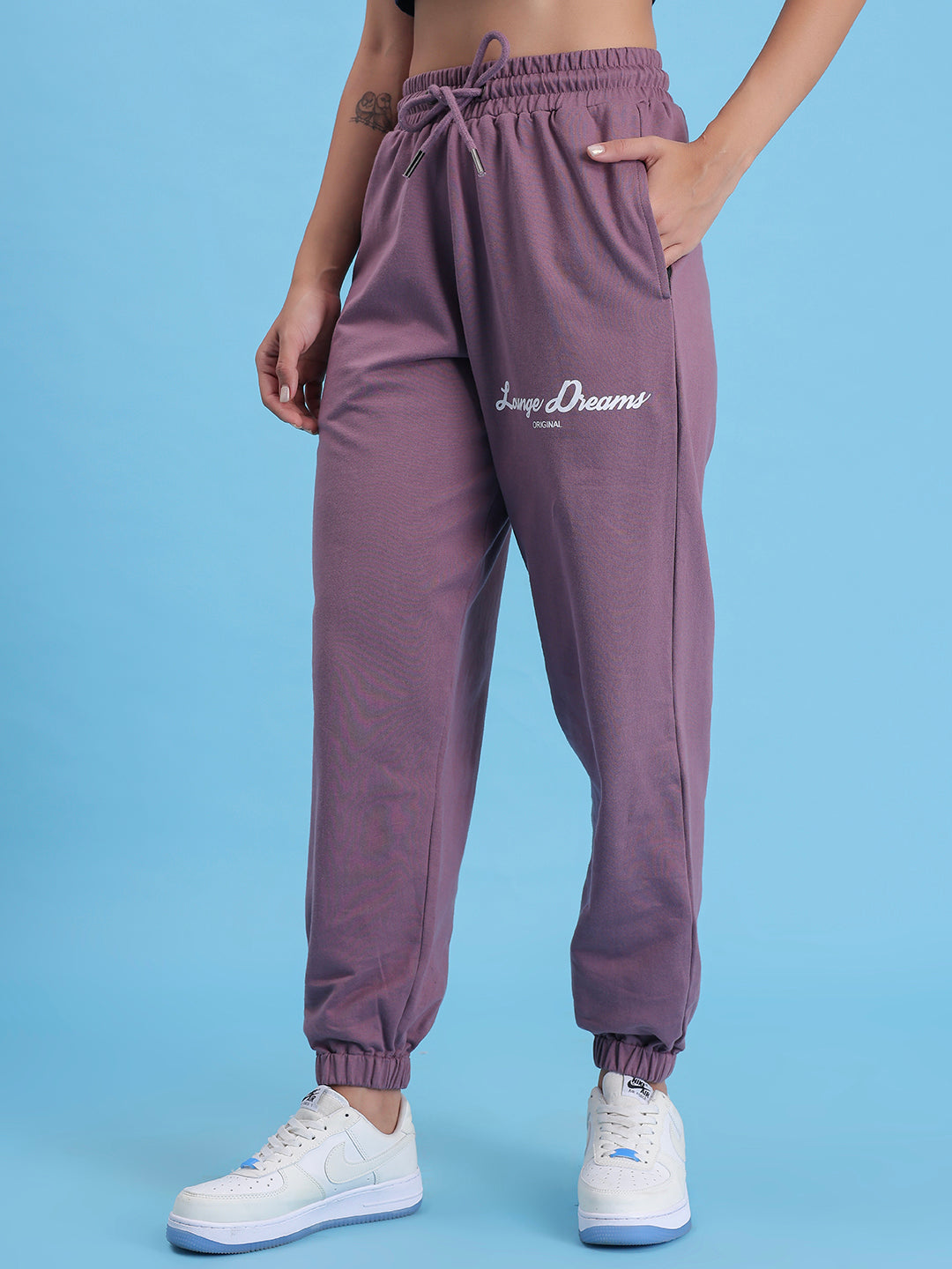 Detail of cuffed hem on lavender cotton joggers