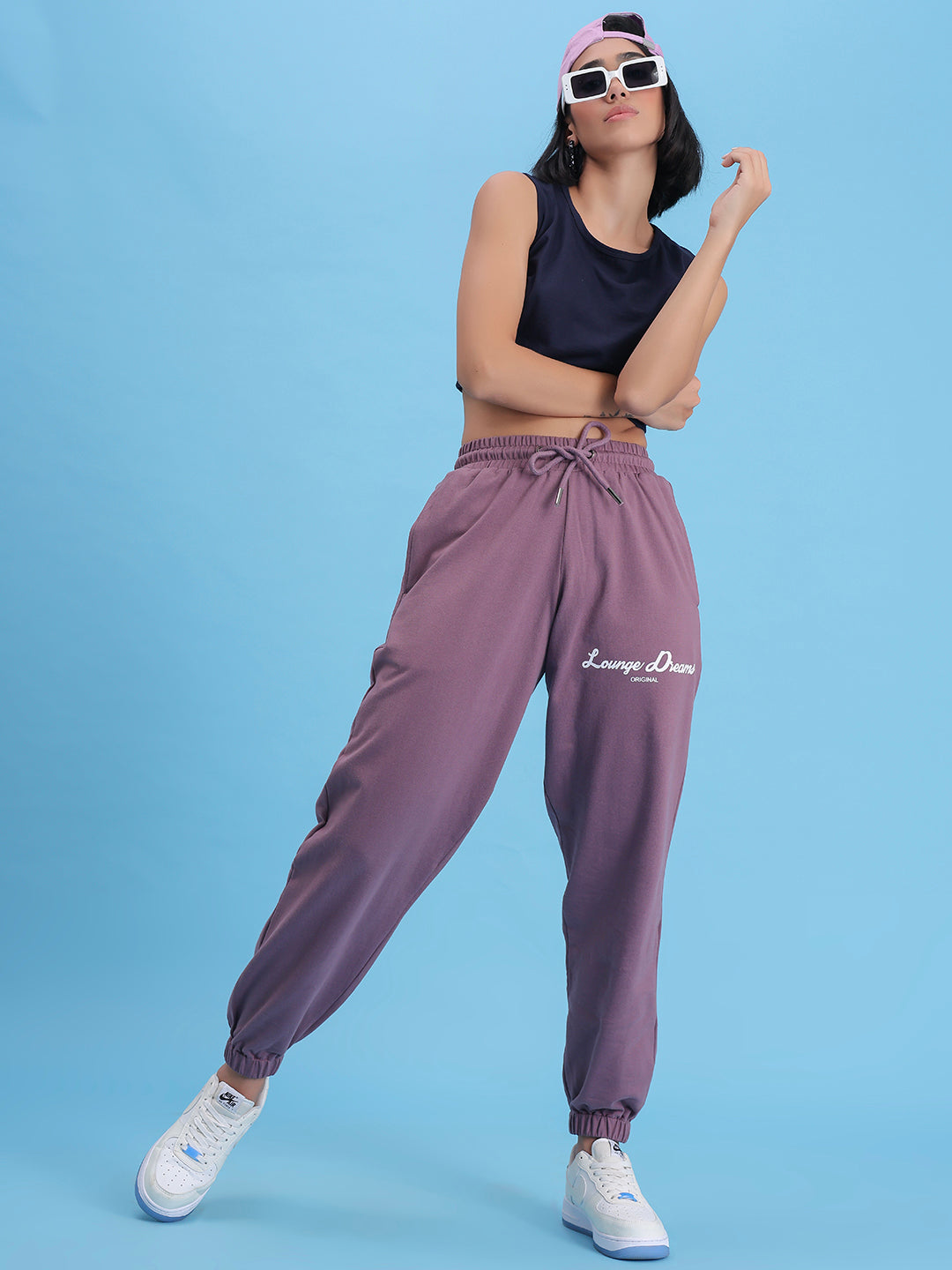 Lifestyle shot of lavender joggers styled with a tee