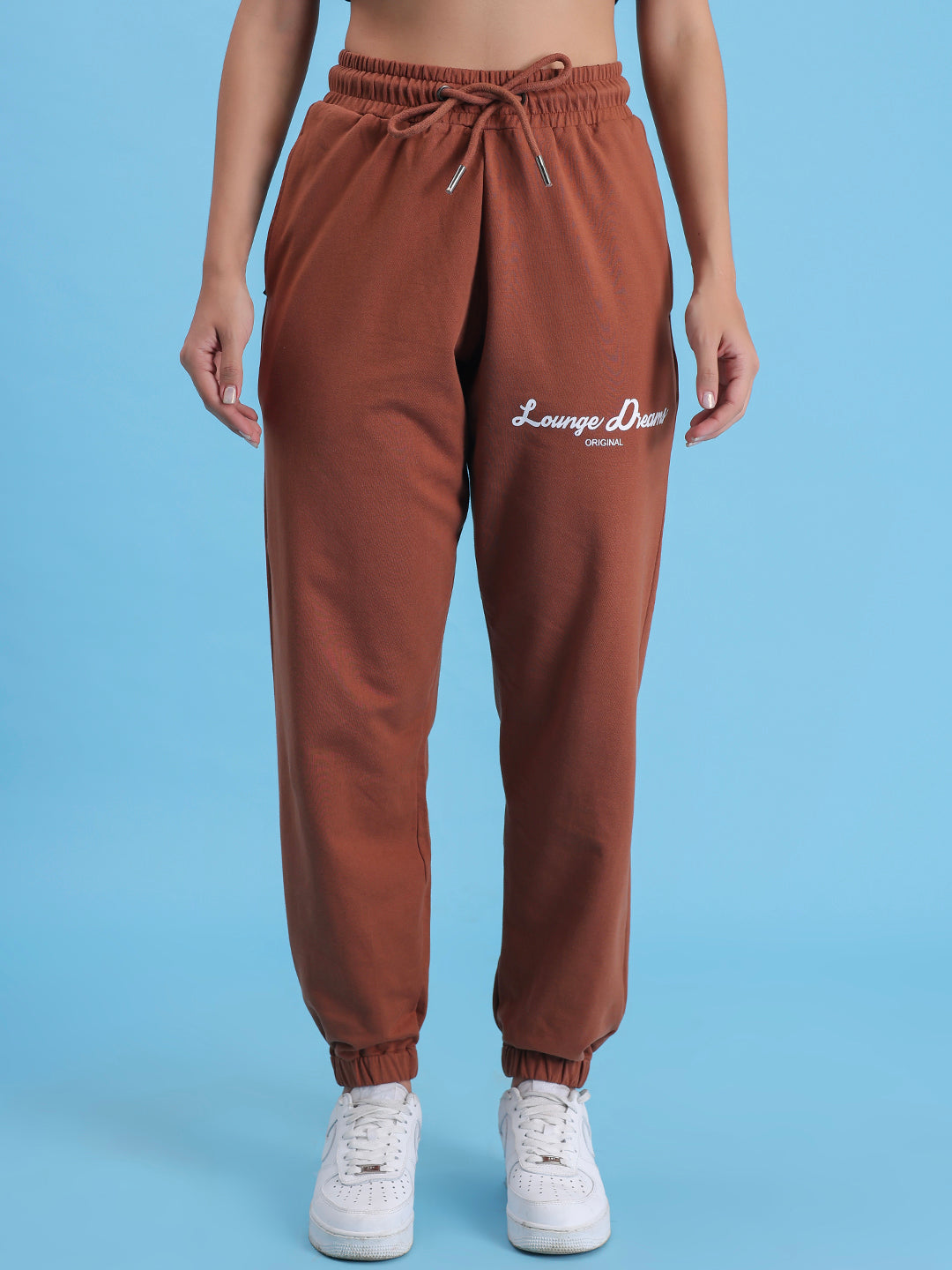Front view of brown cotton knit joggers with tapered leg