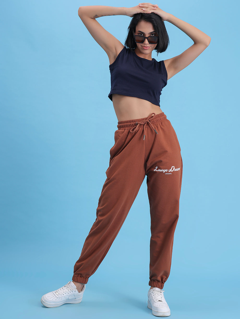 Side view of brown cotton joggers showing pocket