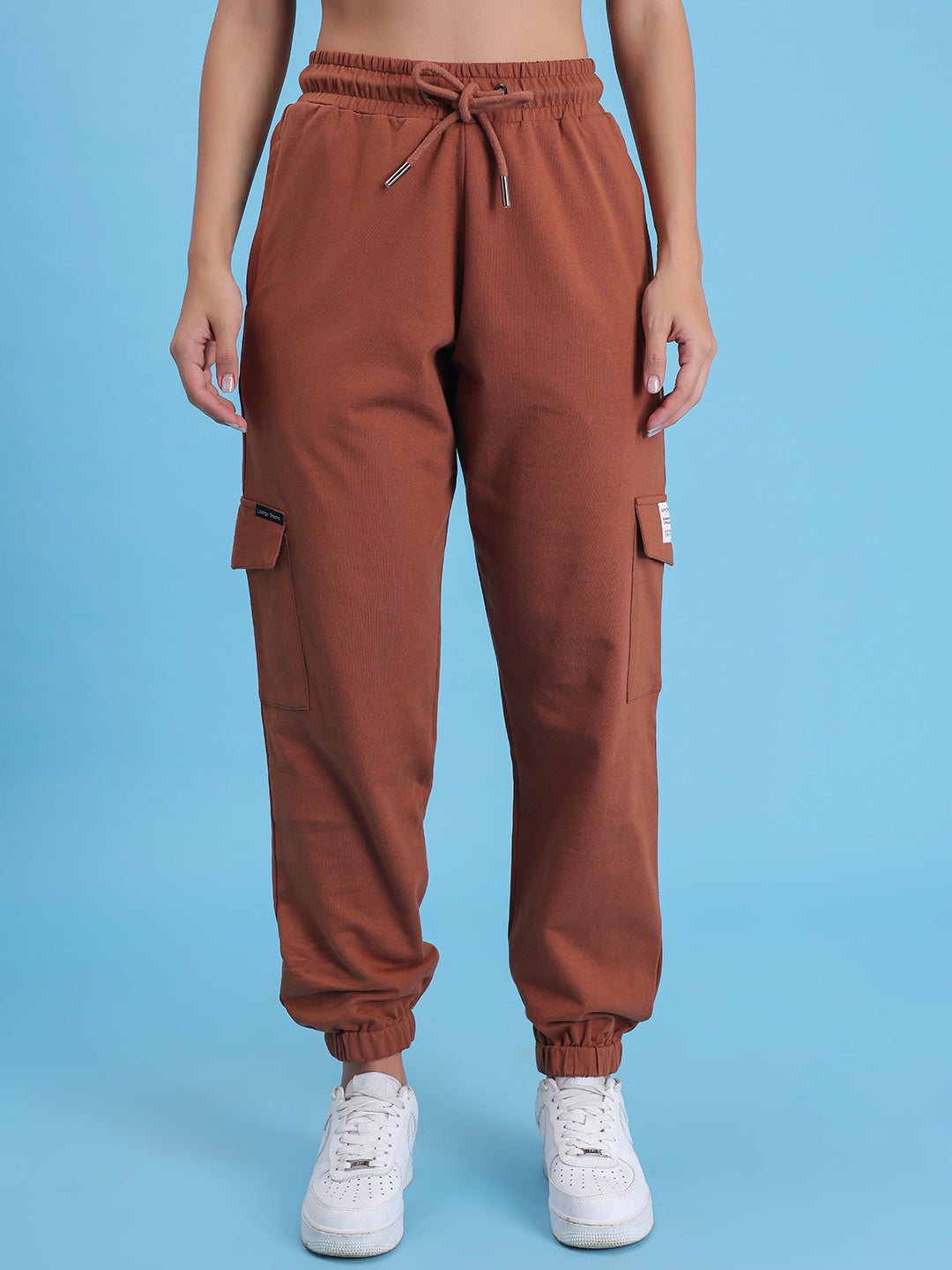 Front view of brown cotton cargo pants with multi-pockets