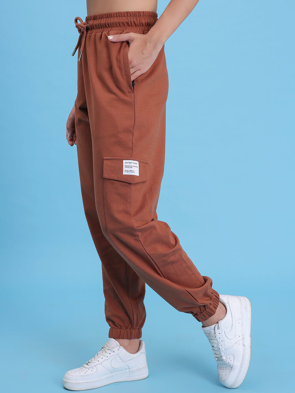 Side view of brown cotton cargo pants showing cargo pocket