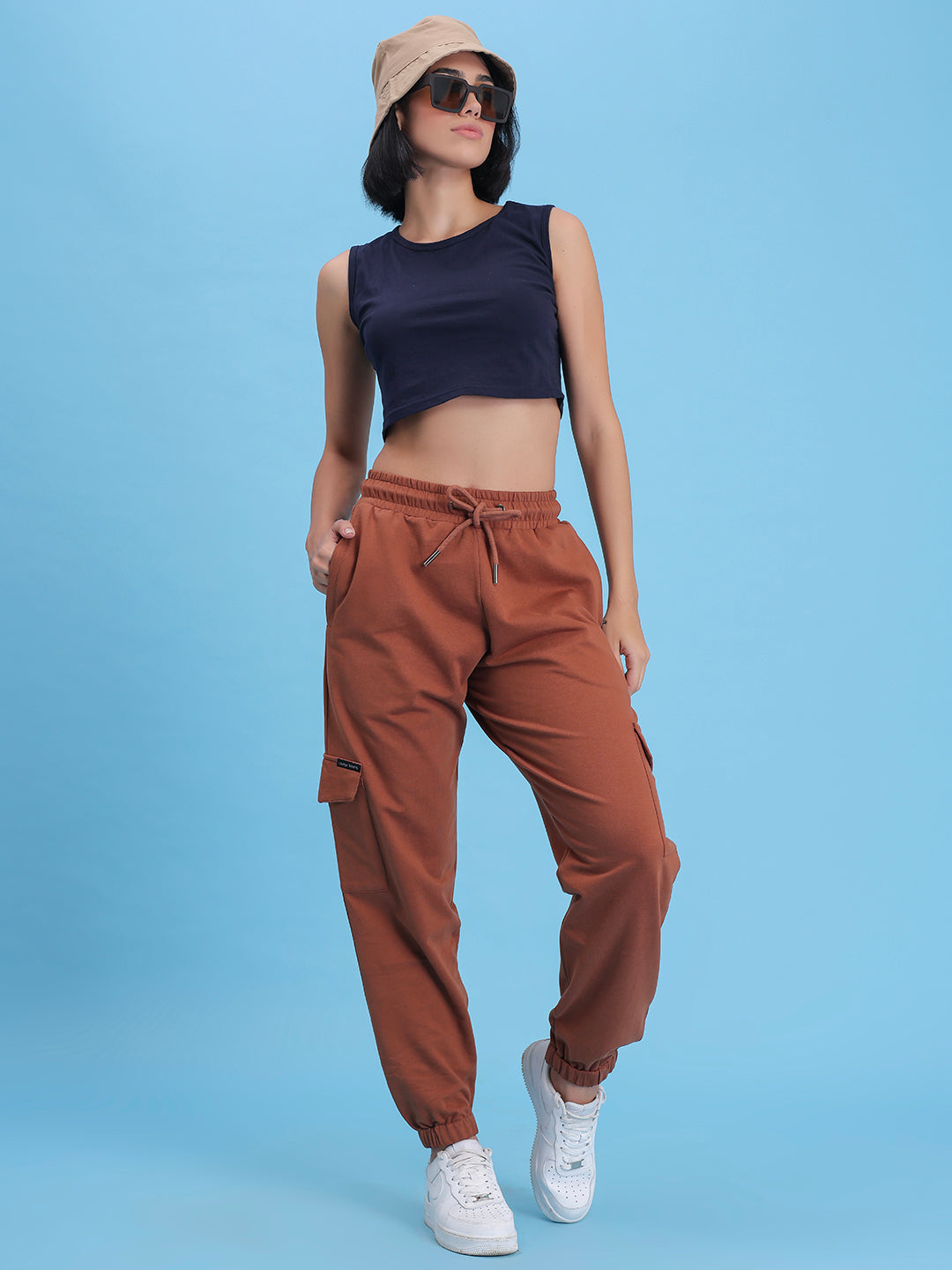 Lifestyle shot of brown cargo pants with a tee
