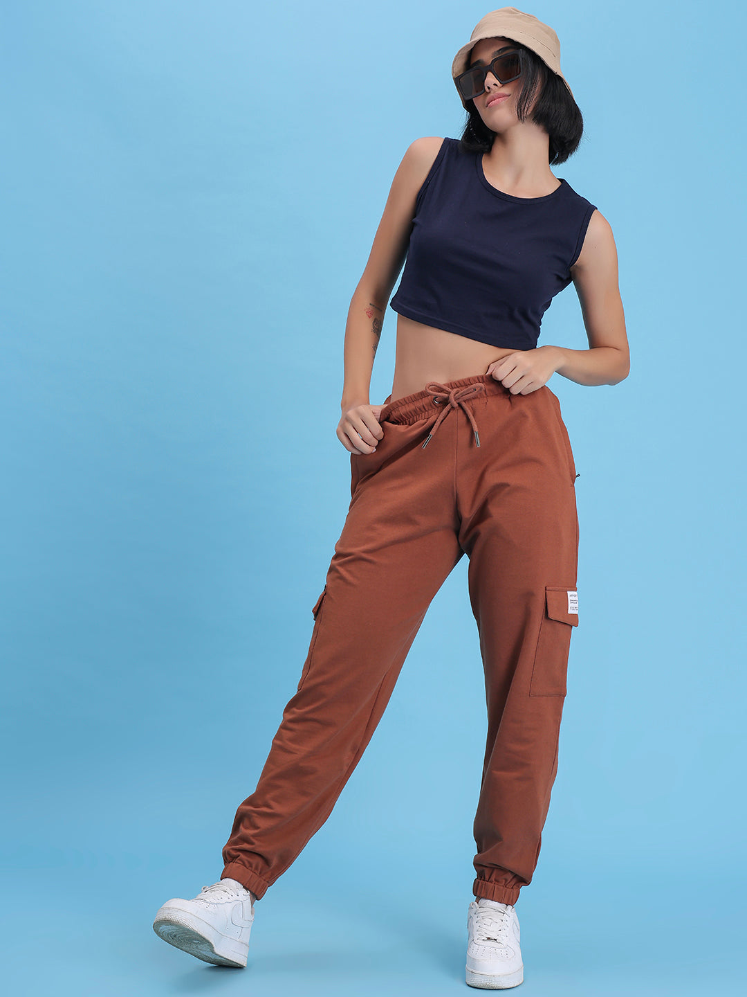 Model wearing brown cotton cargo pants in a casual look