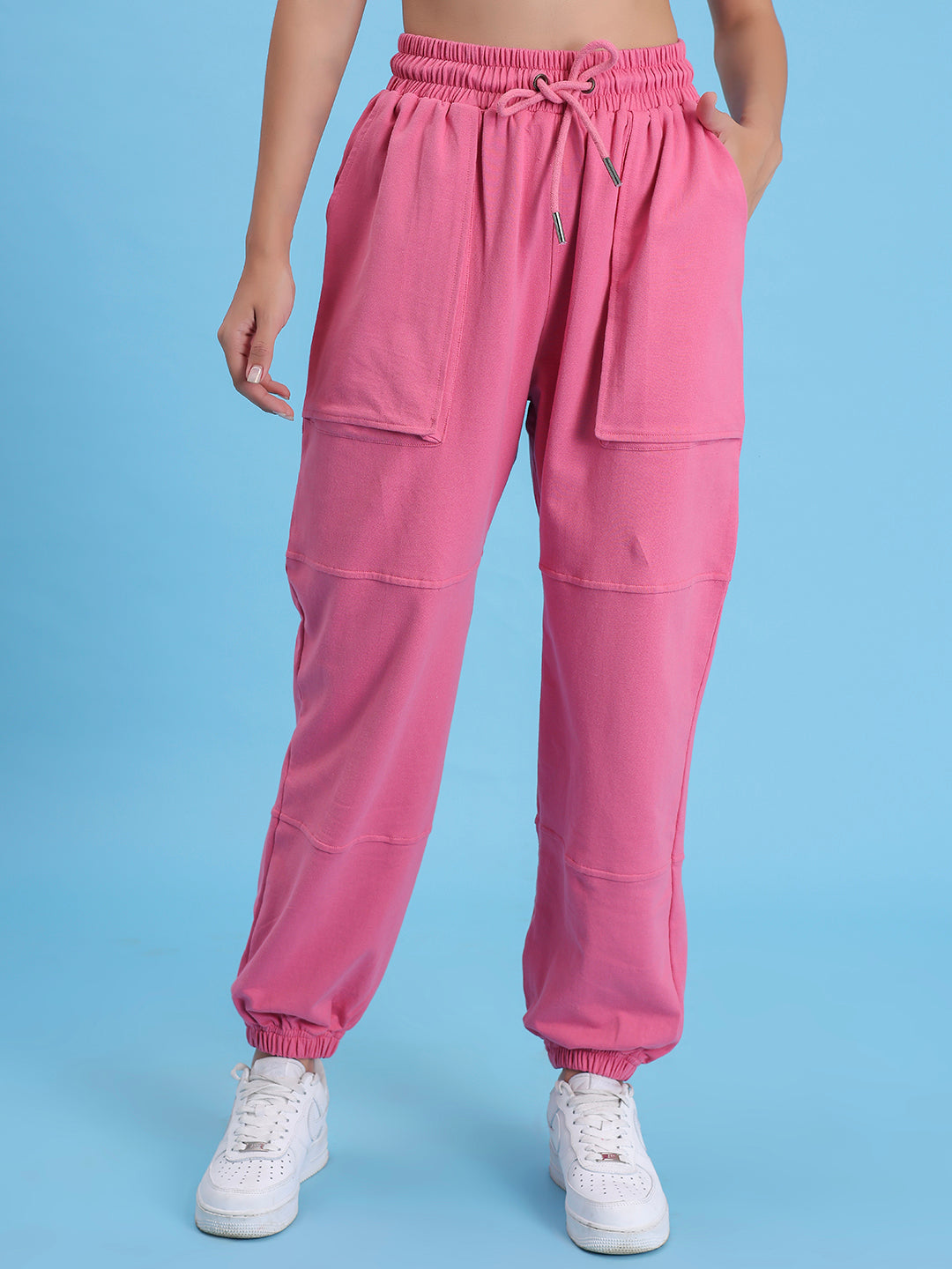 Detail of cuffed hem on pink cotton joggers