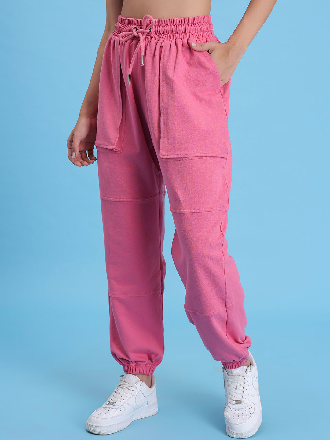 Close-up of elastic waistband on pink knit joggers