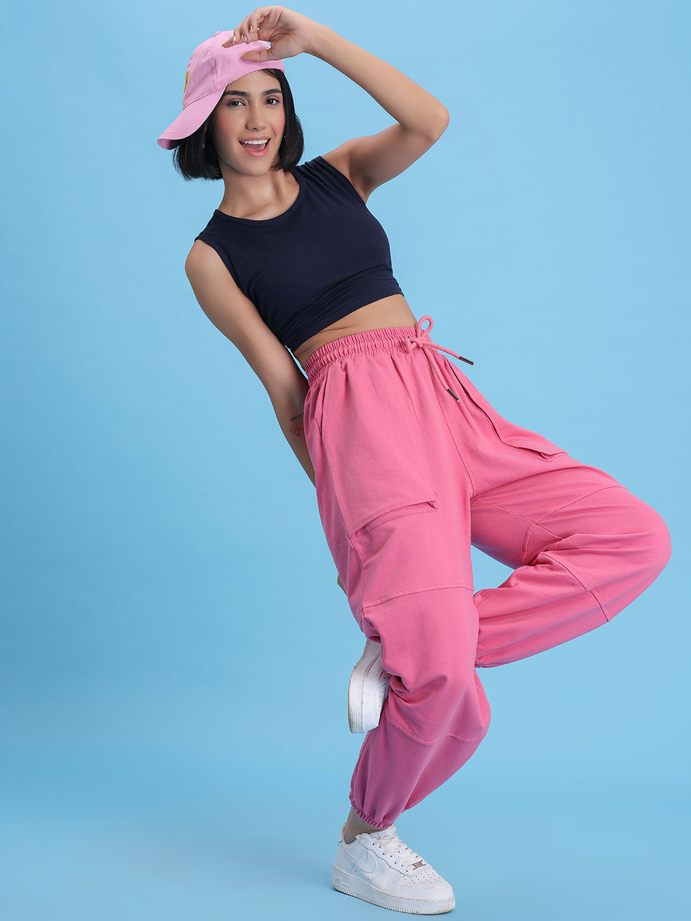 Side view of pink cotton joggers showing side pocket