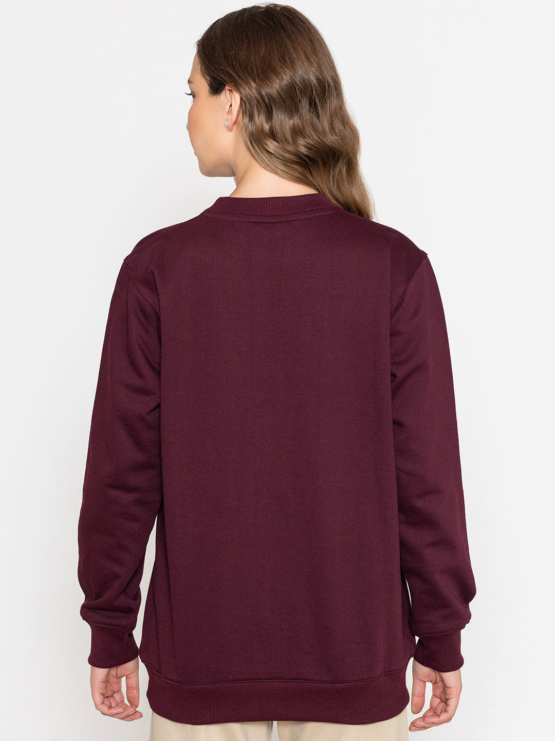 Lifestyle shot of wine tulip print sweatshirt with jeans