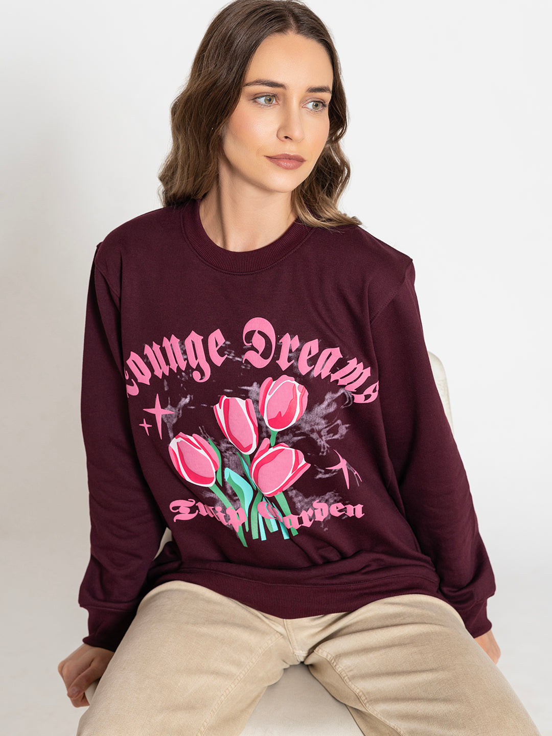 Close-up of tulip garden print on wine sweatshirt
