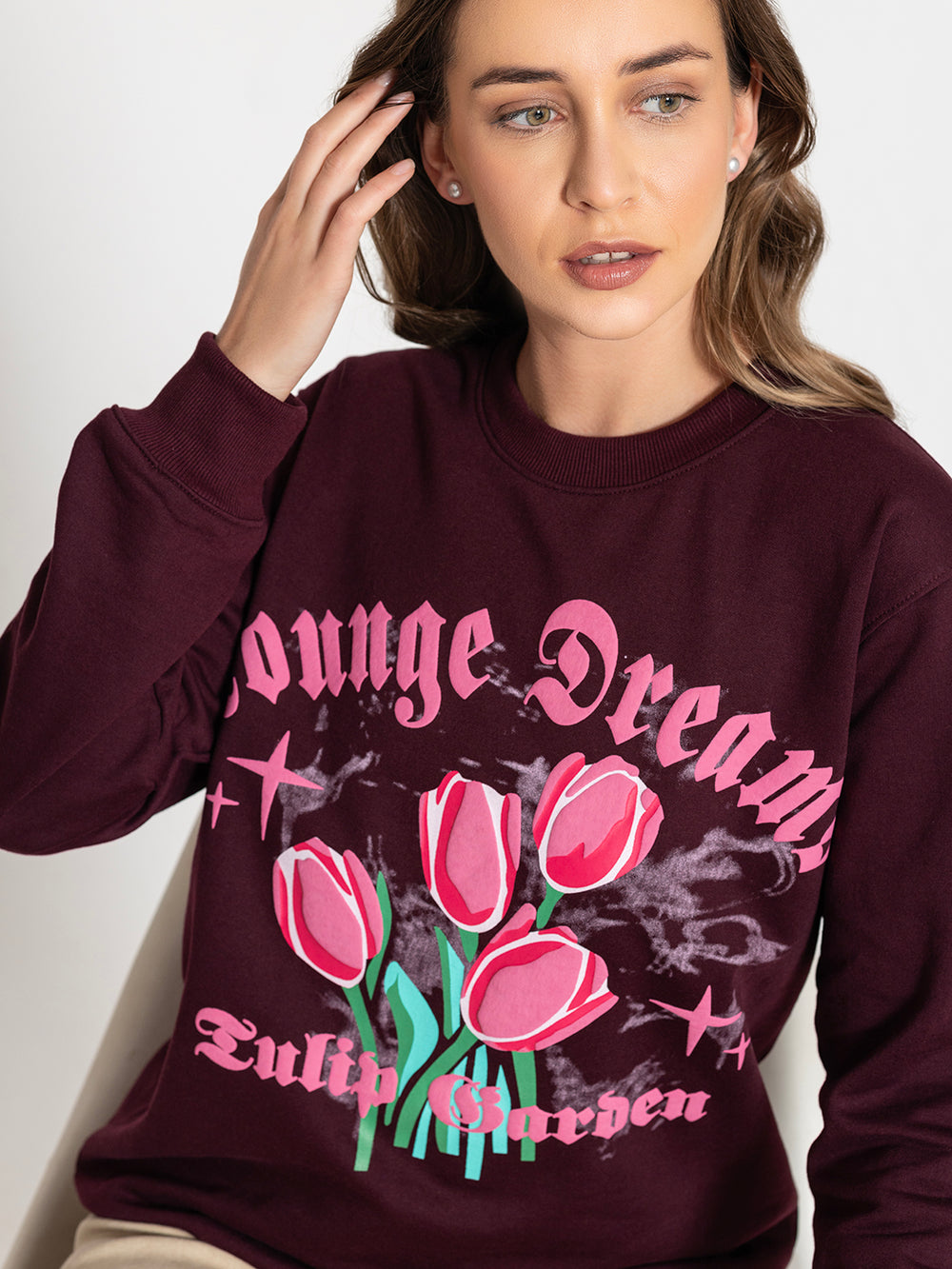 Side view of wine sweatshirt with tulip print