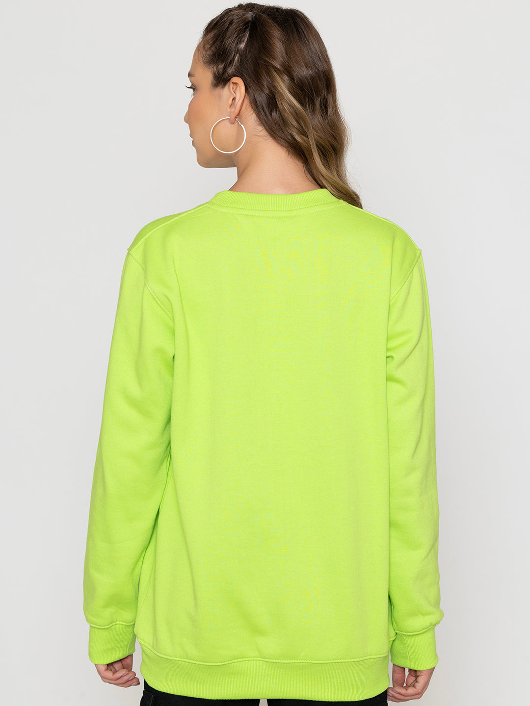 Full-length view of neon green relaxed sweatshirt