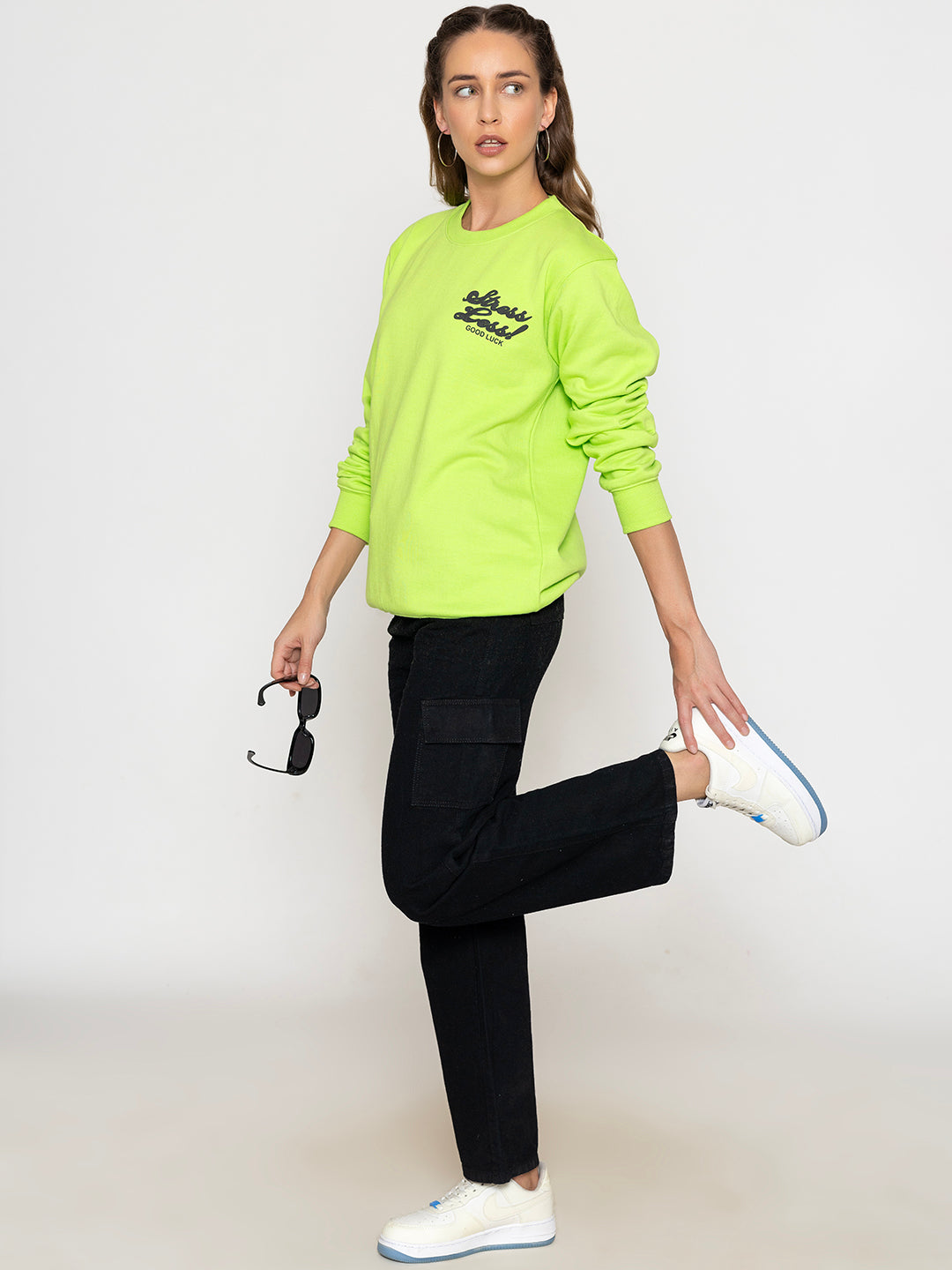 Close-up of print detail on neon green sweatshirt