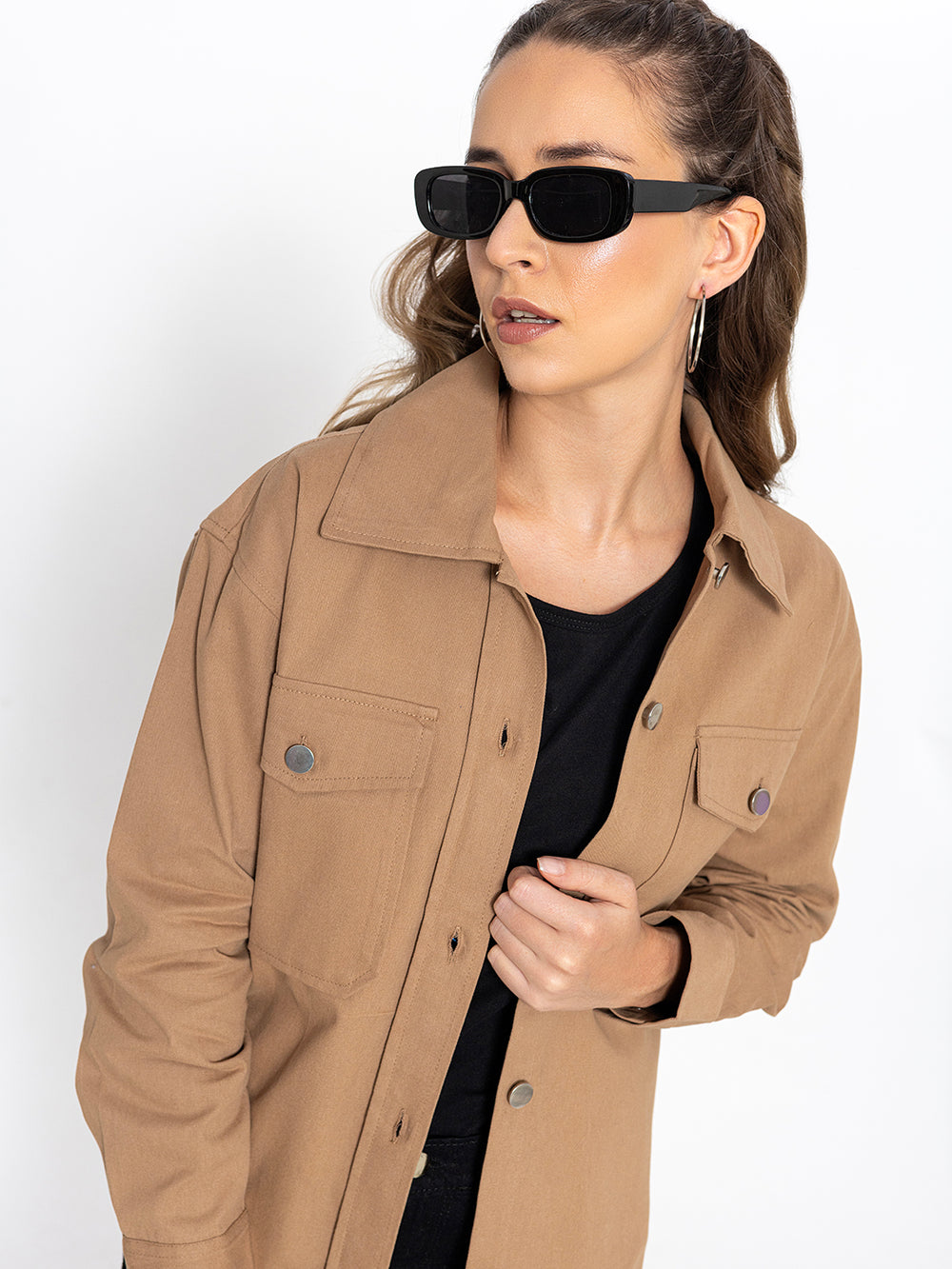 Side view of beige cotton shacket showing oversized fit