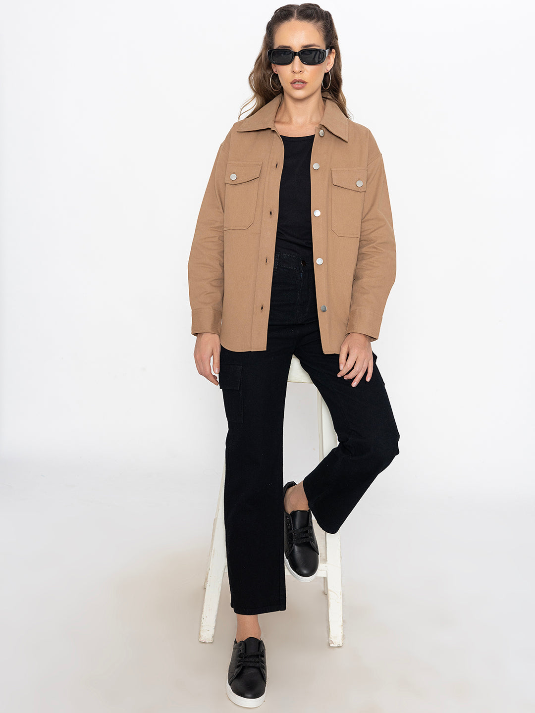 Lifestyle shot of beige shacket layered over a tee