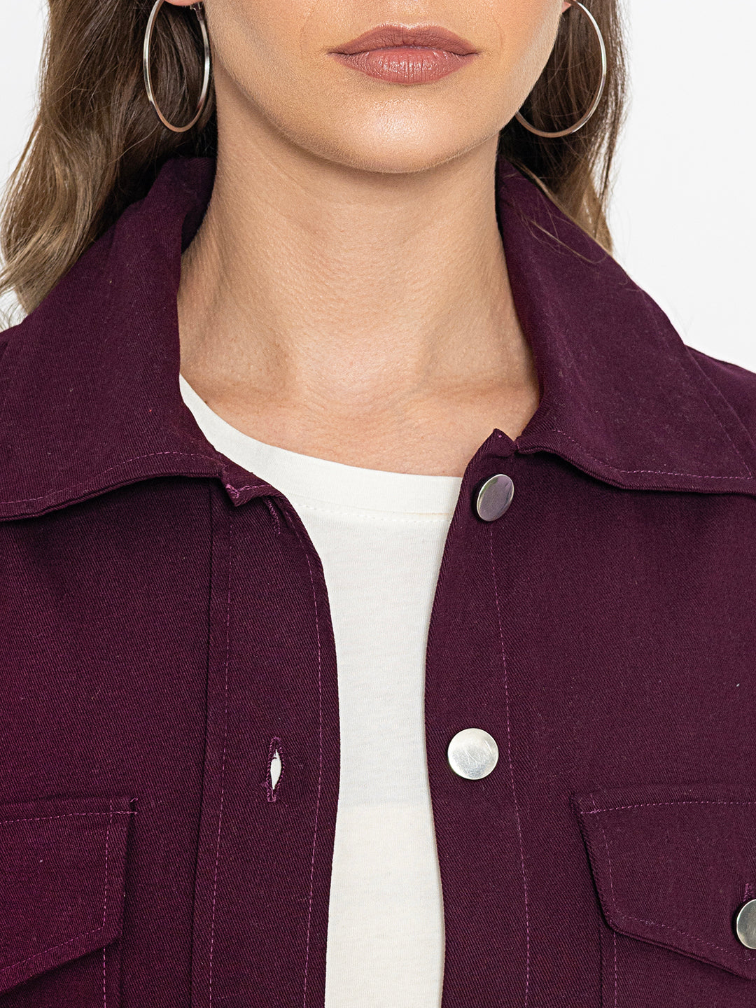 Detail of curved hem on wine cotton shacket