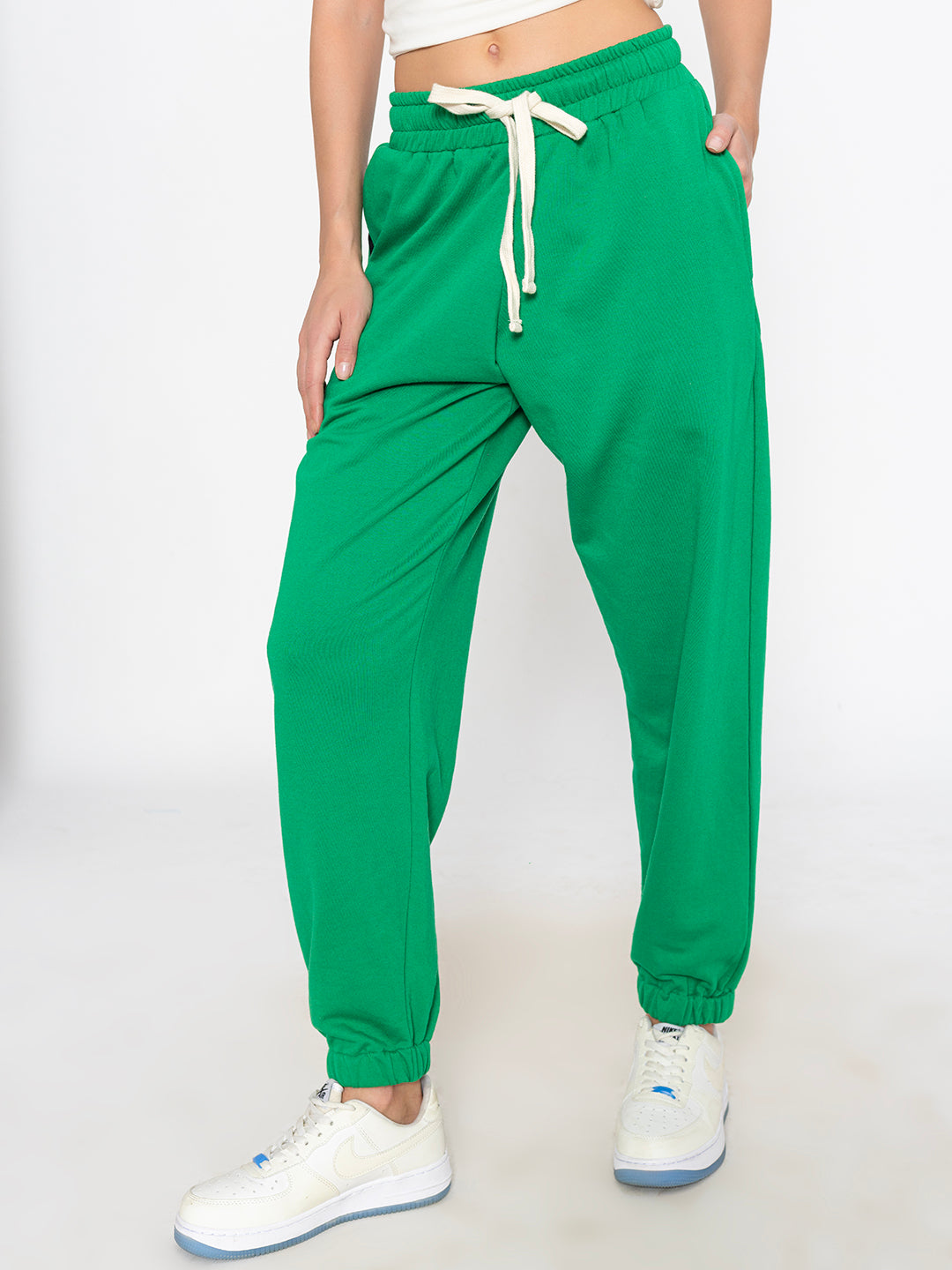 Side view of green cotton blend joggers showing tapered leg fit