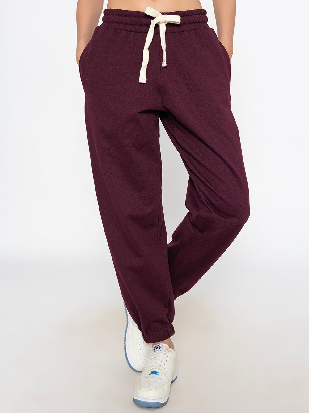 Side view of green joggers showing tapered leg