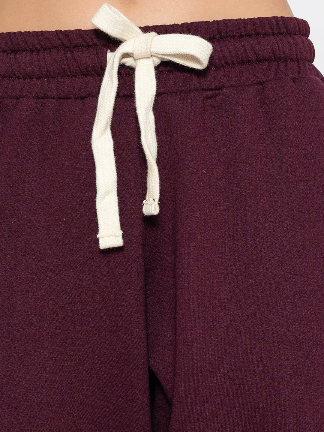 Detail of side pocket on green joggers