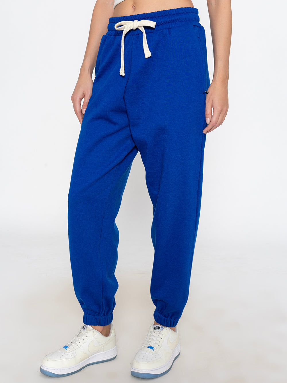 Side view of blue joggers showing tapered leg
